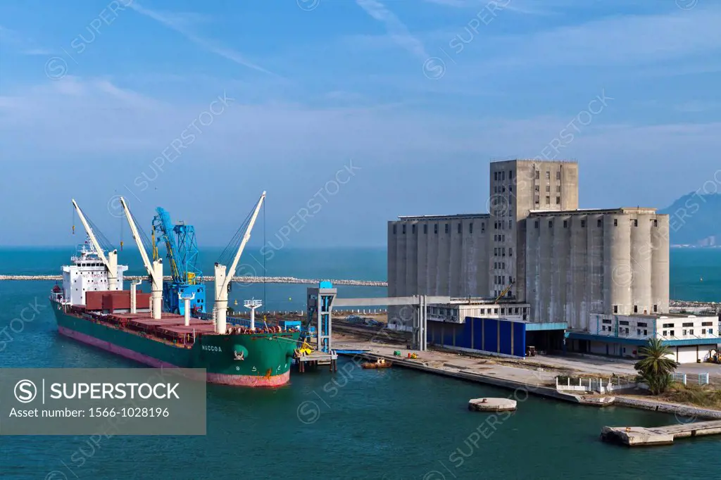 A cargo ship being loaded at the Tunisian Port of La Goulette