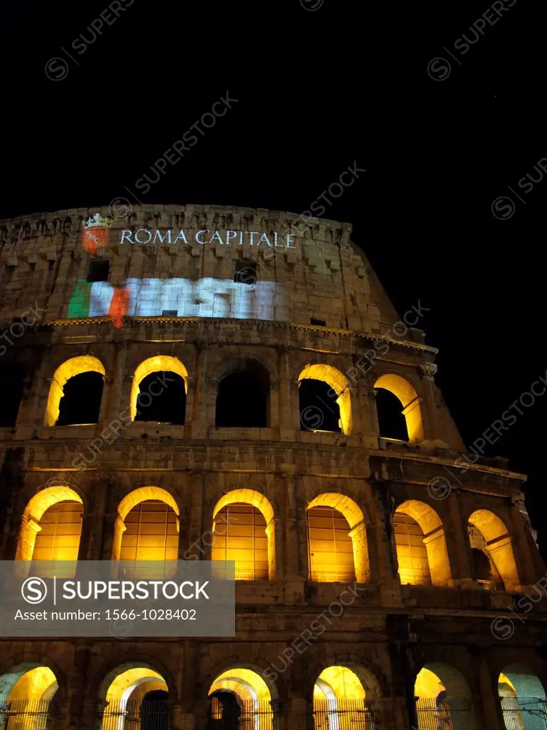 colosseum in rome italy illuminated as a sign of solidarity for the two Italian army marines soldiers arrested in India for allegedly killing two fish...
