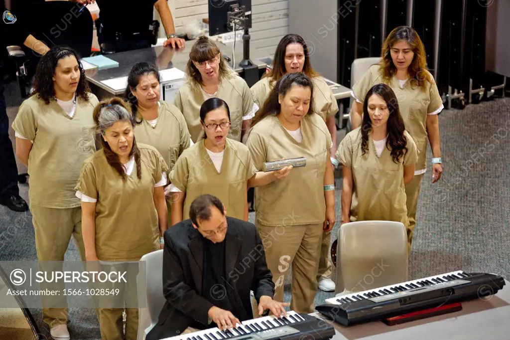 A choir of female inmates at the Santa Ana, CA city jail sings at graduation of a jail educational program