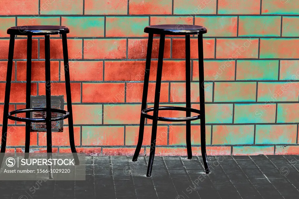 Brick wall with chairs