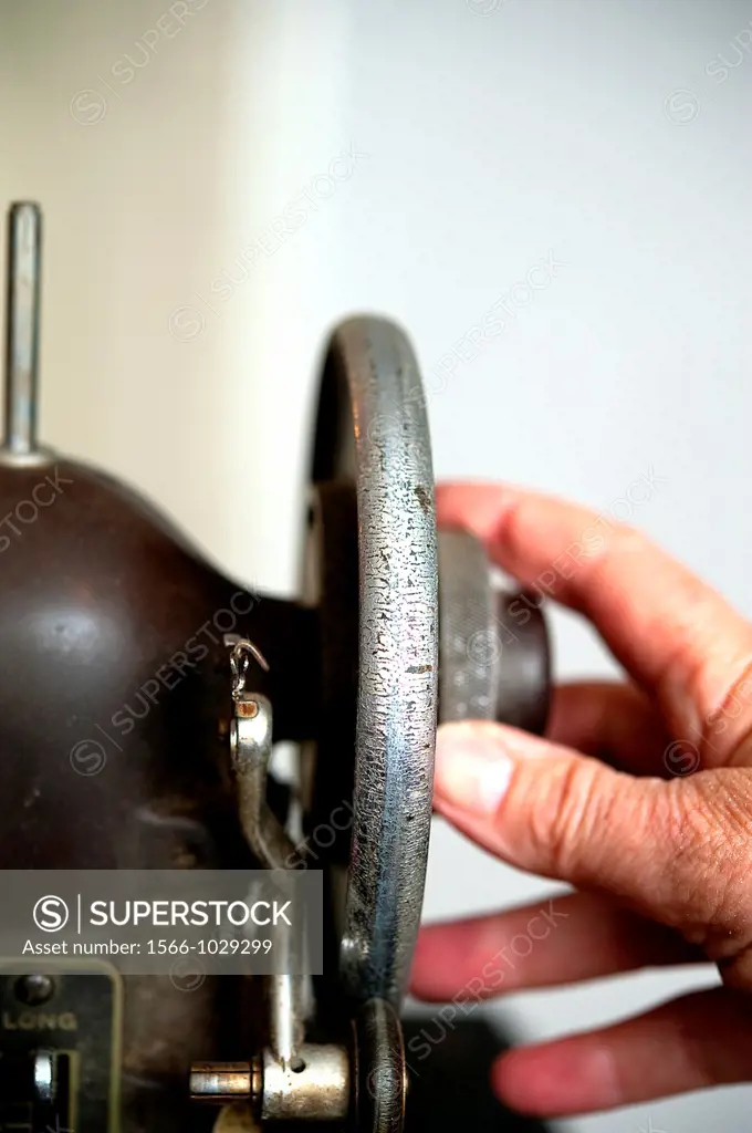 Hand Turning Wheel on Antique Sewing Machine