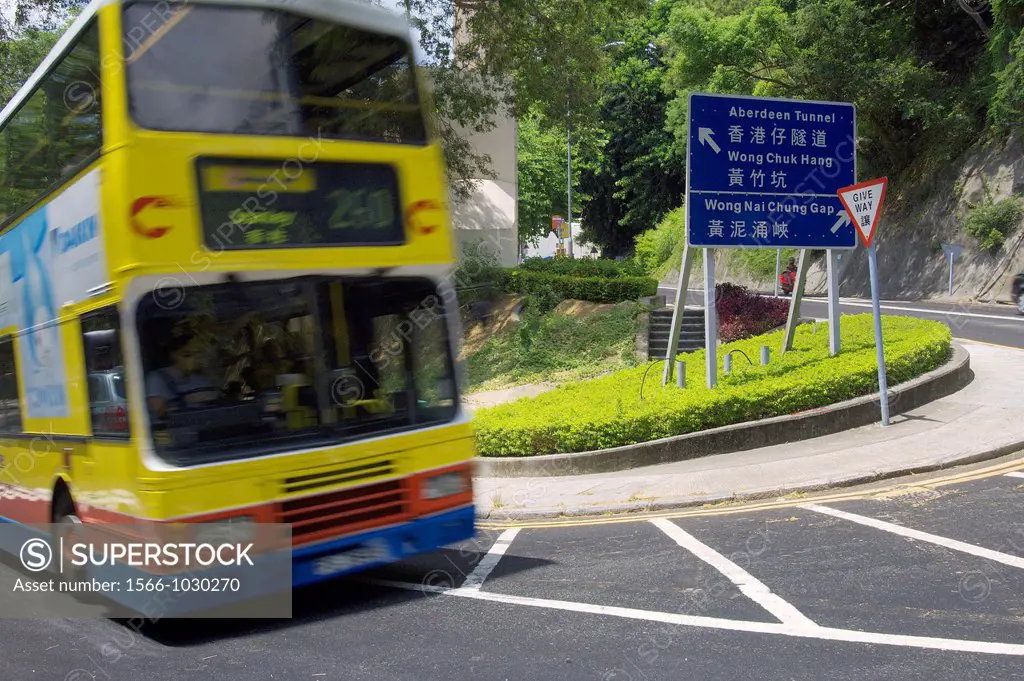 a double deck bus on duty on a street of hong kong island  hong kong  china  asia