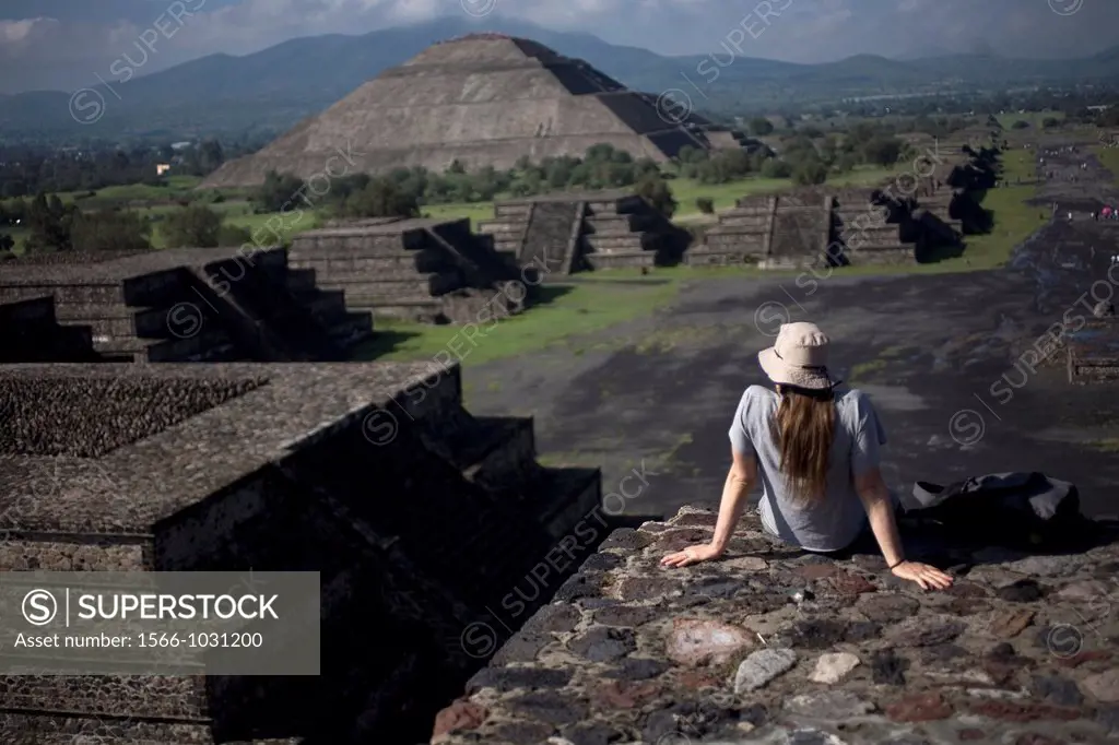 A woman looks at the Pyramid of the Sun, back left, from the Pyramid of the Moon in Teotihuacan, Mexico City Teotihuacan that means City of the Gods´...