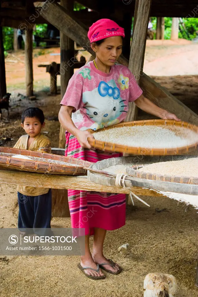 Woman and son with housework  Karen ethnic group people  Baan Mae Jork village  Chiang Mai province  Thailand