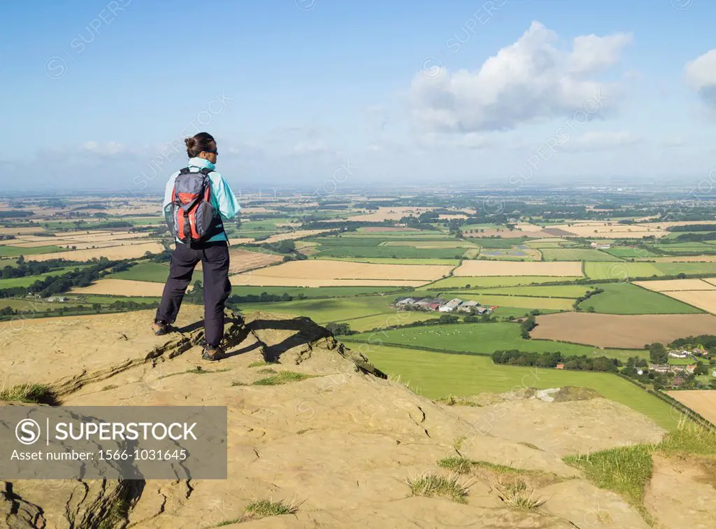 Female hiker on Roseberry Topping 320m on The Cleveland Way National Trail  North York Moors National Park near Great Ayton, North Yorkshire, England,...