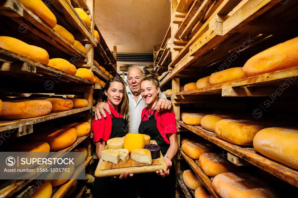 Jaume Pons and granddaughters, Binibeca-made cheese - denomination of origin craftsman-farm Alcaiduset Mahon, Alaior, Menorca, Balearic Islands, Spain...