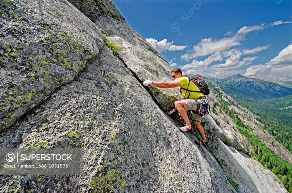 Rock climbing a route called the Regular Route which is rated 5,6 and located on Slick Rock near the city of McCall in the Salmon River Mountains of c...