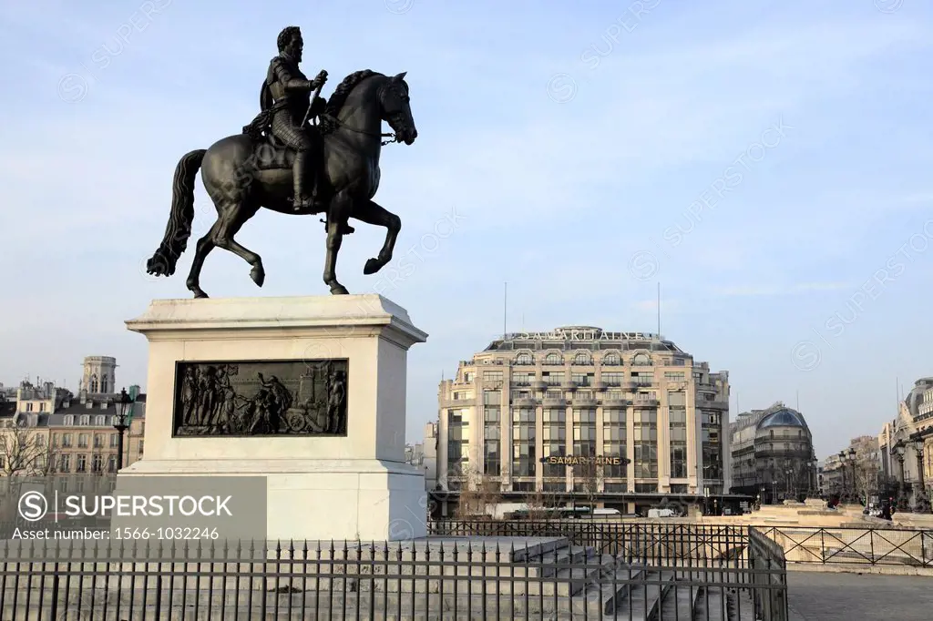 The equestrian statue of the King Henry IV on Pont Neuf New Bridge with La Samaritaine department store in the background  Paris  France.