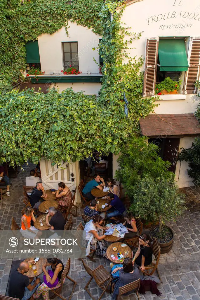 Paris, France, Tourists Sharing Meals in French Bistro Cafe Restaurant Terrace, in Montmartre Area, ´Le Troubadour´