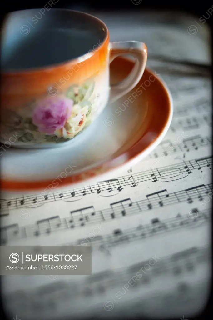Cup and music score