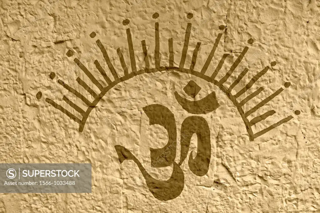 A holy sign called om is painted on front side of a Hindu temple, Maharashtra, India