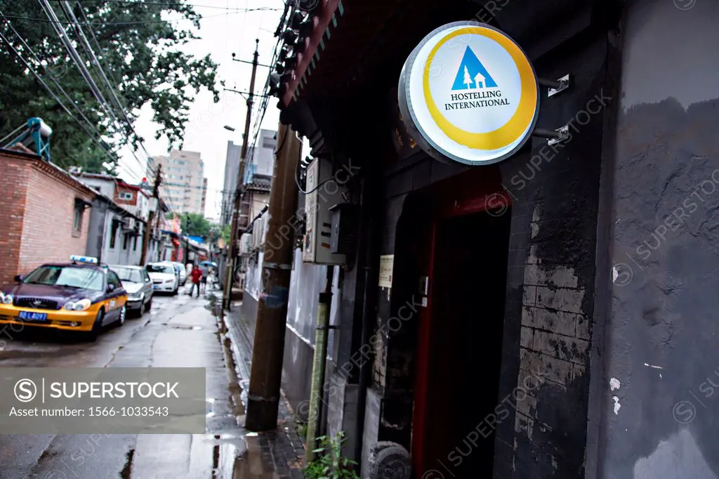 Sign for the International Youth Hostel along a hutong lane in a traditional courtyard home called a siheyuan in Beijing, China
