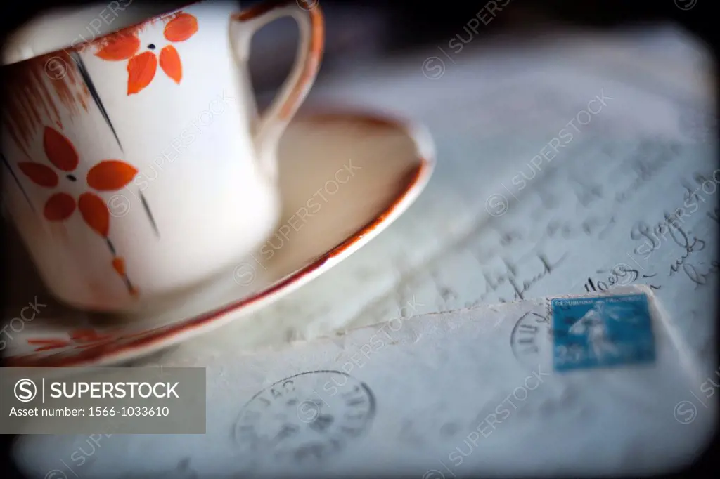 Cup and old letters