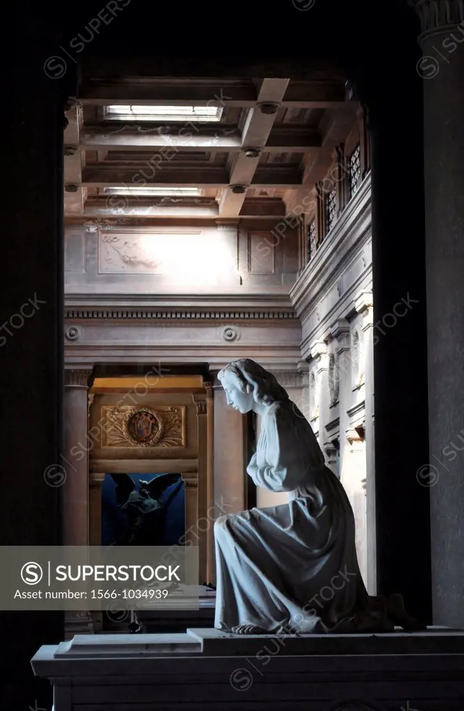 Bologna, Italy: statue by a grave at the Monumental Cemetery of Certosa  
