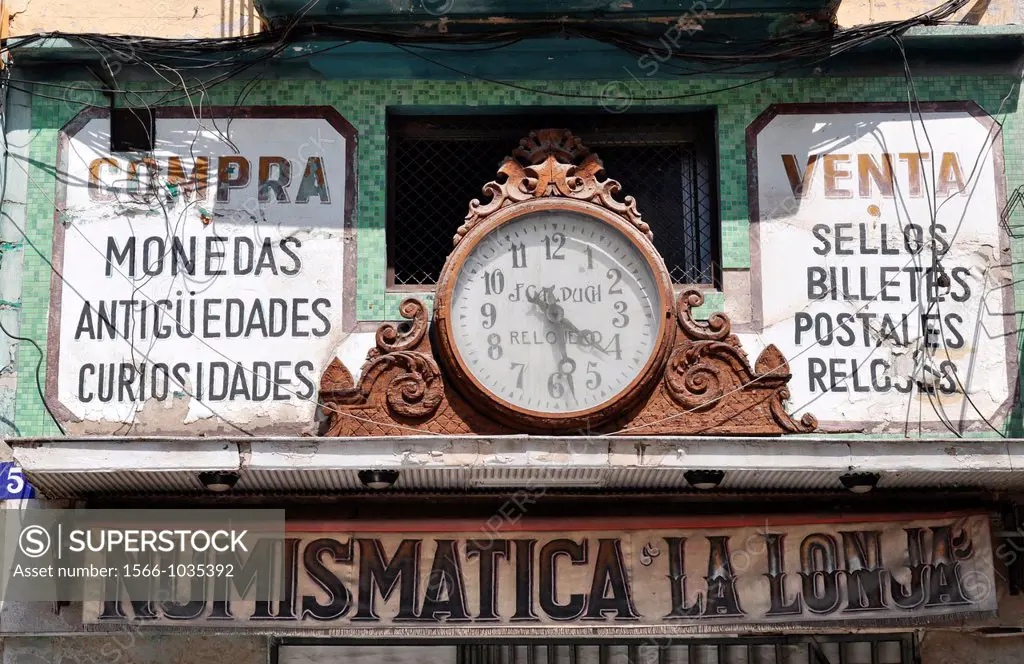 Valencia, Spain: sign of an old numismatic shop in the city center