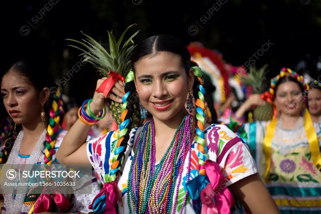 A young woman performs the pineapple dance during the Guelaguetza parade in Oaxaca, Mexico, July 21, 2012  Oaxaca commemorates the ´Guelaguetza,´ an a...