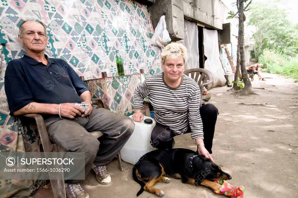 A homeless couple with their dog