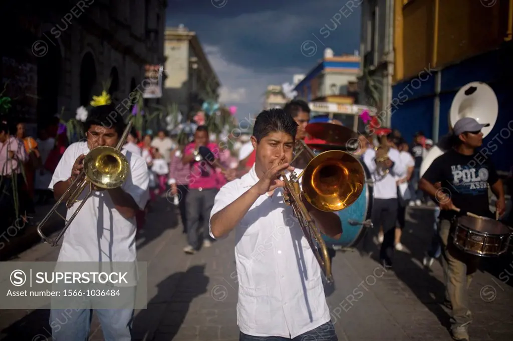 A music band performs during the Convite during the celebration of Carmen Alto neighborhood, in Oaxaca, Mexico, July 12, 2012, in this tradition of th...