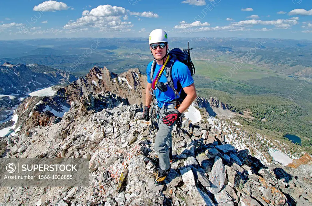 On the summit after climbing The June Couloir on the North Face of Williams Peak high above the Sawtooth Valley in the Sawtooth Mountains near the tow...