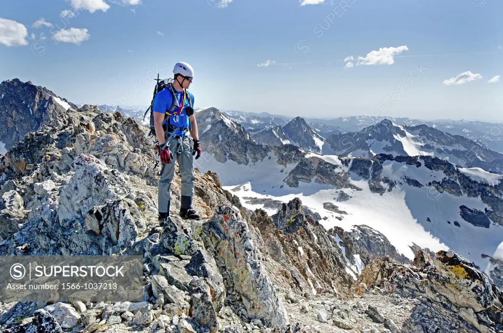 On the summit after climbing The June Couloir on the North Face of Williams Peak high above the Sawtooth Valley in the Sawtooth Mountains near the tow...
