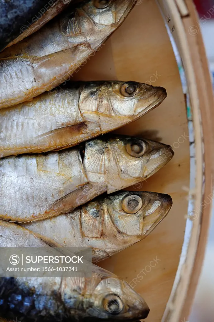 Dried sardines in a wooden box