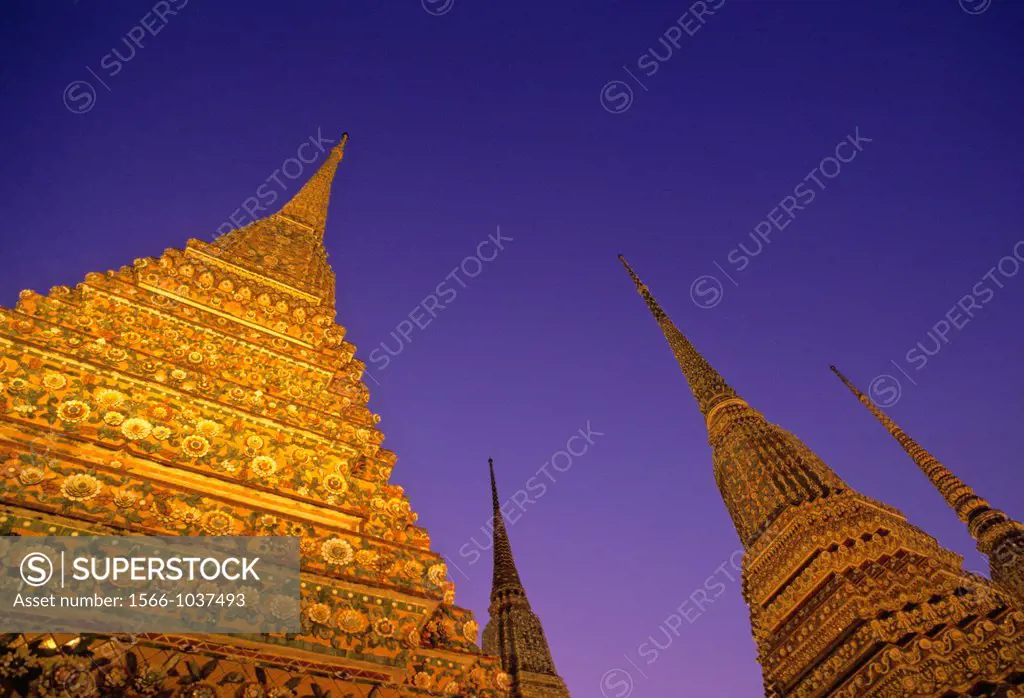 Illuminated Prang of Wat Pho in Bangkok