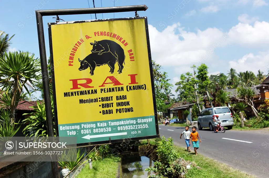 Sign advertising a pork butcher shop and restaurant