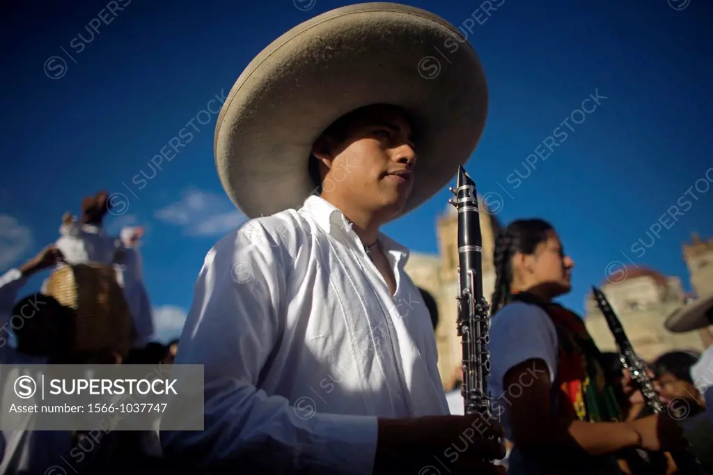 A clarinetist from a music band wearing a Mexican sombrero performs in the Guelaguetza parade in Oaxaca, Mexico, July 21, 2012  Oaxaca commemorates th...