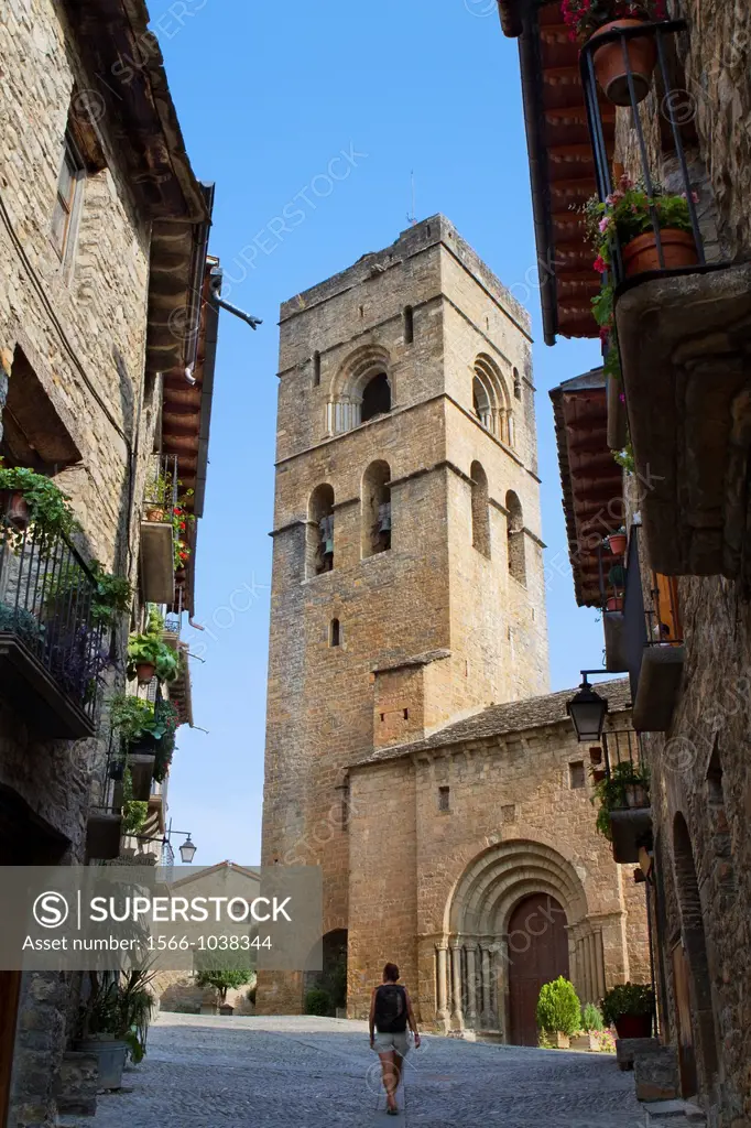 Street and bell tower of the romanesque church of Santa Maria, in Aínsa, a medieval village in Sobrarbe region, declarated Historical-Artistic Site  H...