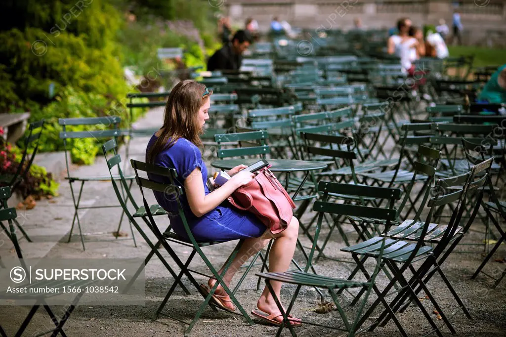 A reader uses her Amazon Kindle electronic book in Bryant Park in New York