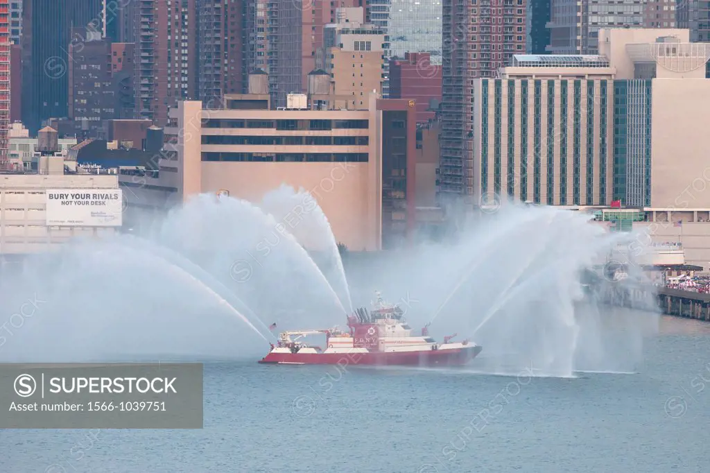 FDNY fire boat Marine 1 ´Three Forty Three´ puts on a water show on the Hudson river prior to the annual Macy´s Fourth of July fireworks on Wednesday,...