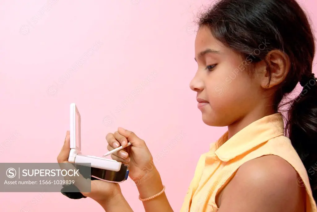 12 years old girl playing on a games console
