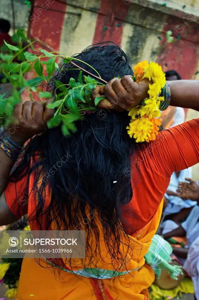 Woman possessed by the goddess Ankalaparamecuvari, who is renowned throughout Tamil Nadu for making her power available to devotees, Mel Malaiyanur te...