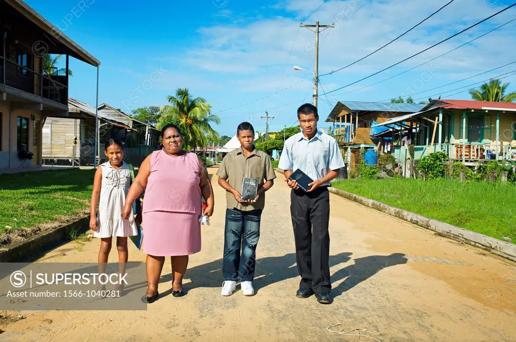 Family going to Church on sunday, Bocas del Toro town, Colon island, Bocas del Toro province, Caribbean sea, Panama.
