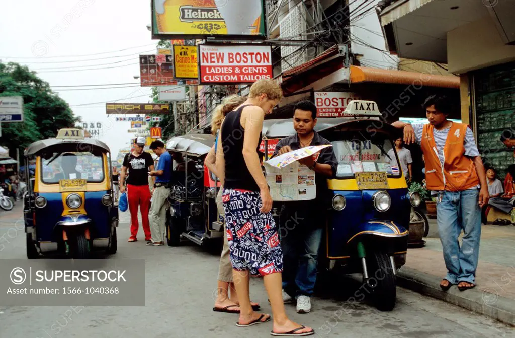 Tuk Tuk Driver encourages tourists to a city tour of Bangkok