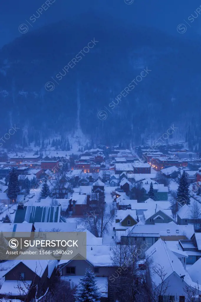 USA, Colorado, Telluride, elevated town view from Tomboy Road in snowstorm, dawn