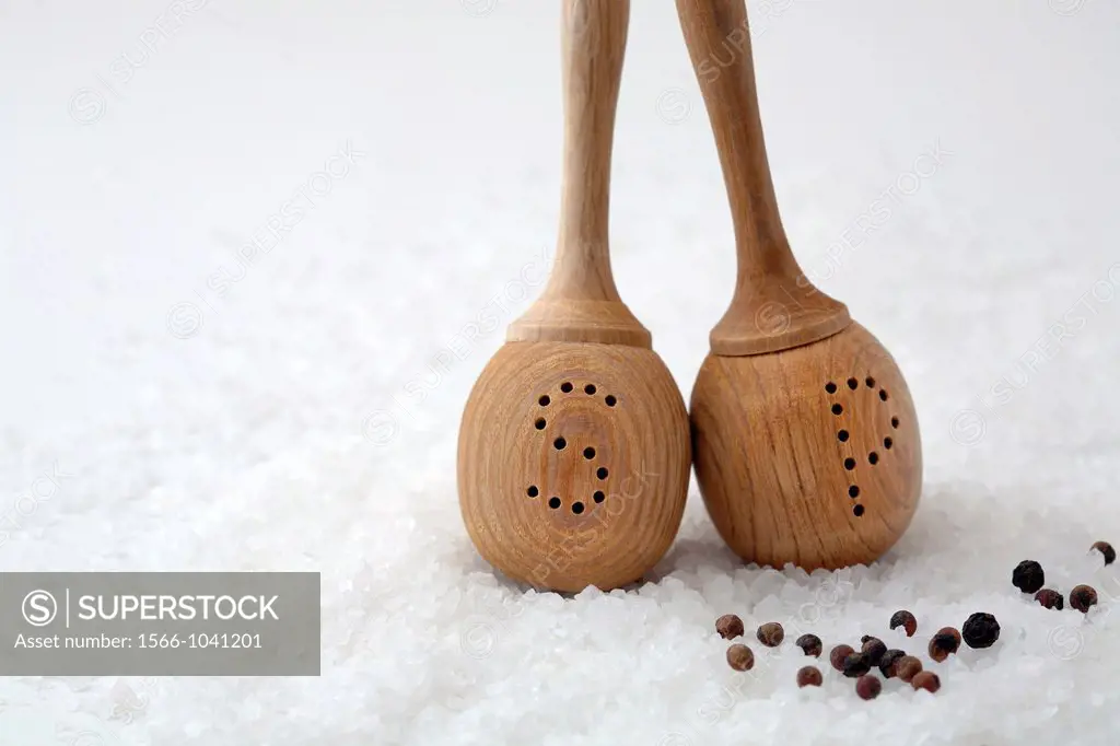 Salt and pepper wooden shakers on salt and pepper balls