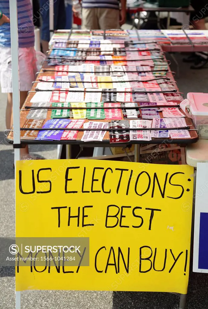 A sign that reads ´US Elections : The Best Money Can Buy´ at a booth selling bumper stickers on Independence Day 2012 in Greensboro, North Carolina, U...