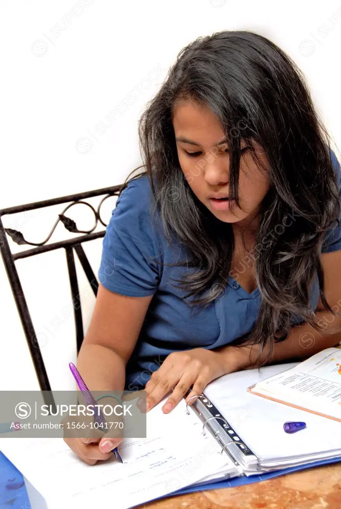 16 years old teen age girl doing her home work