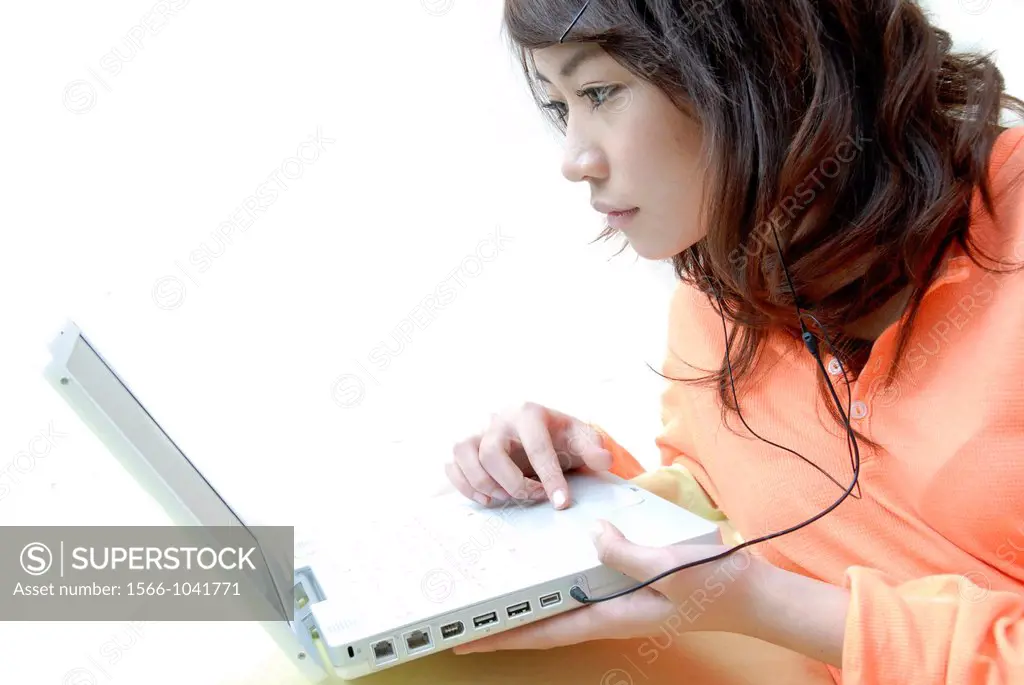 Teenager using a laptop computer