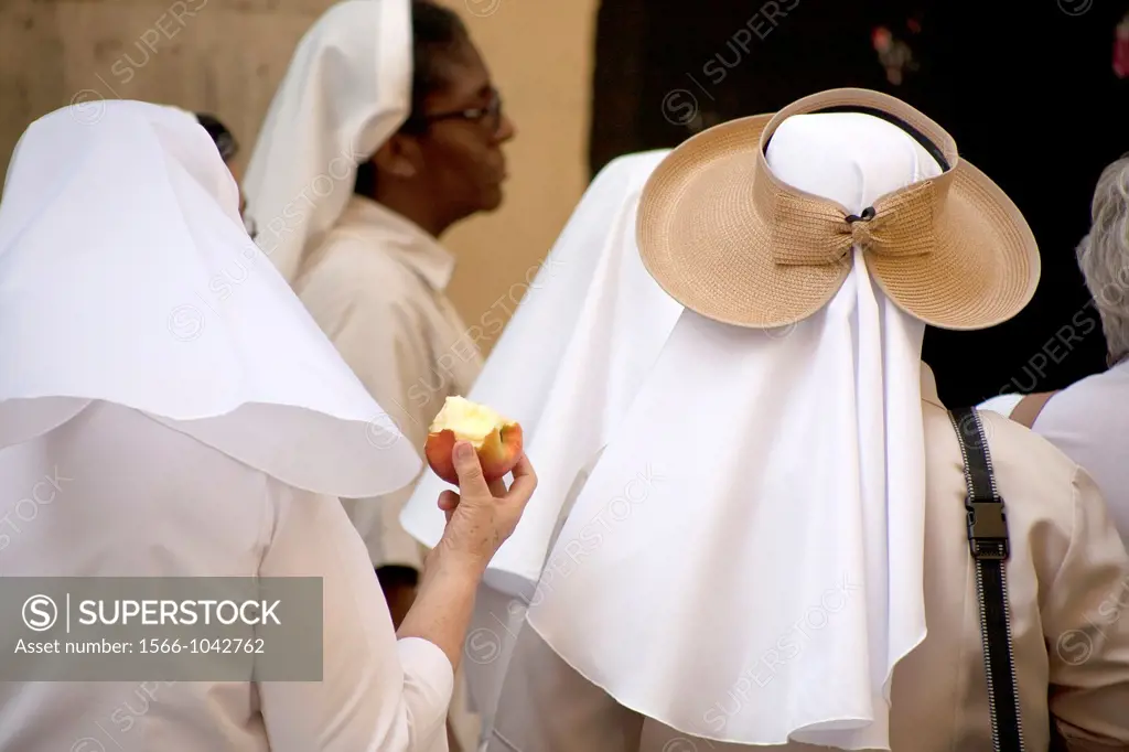 Nun with apple and nun with original hut in Caballeros Street, in Valencia, Spain.