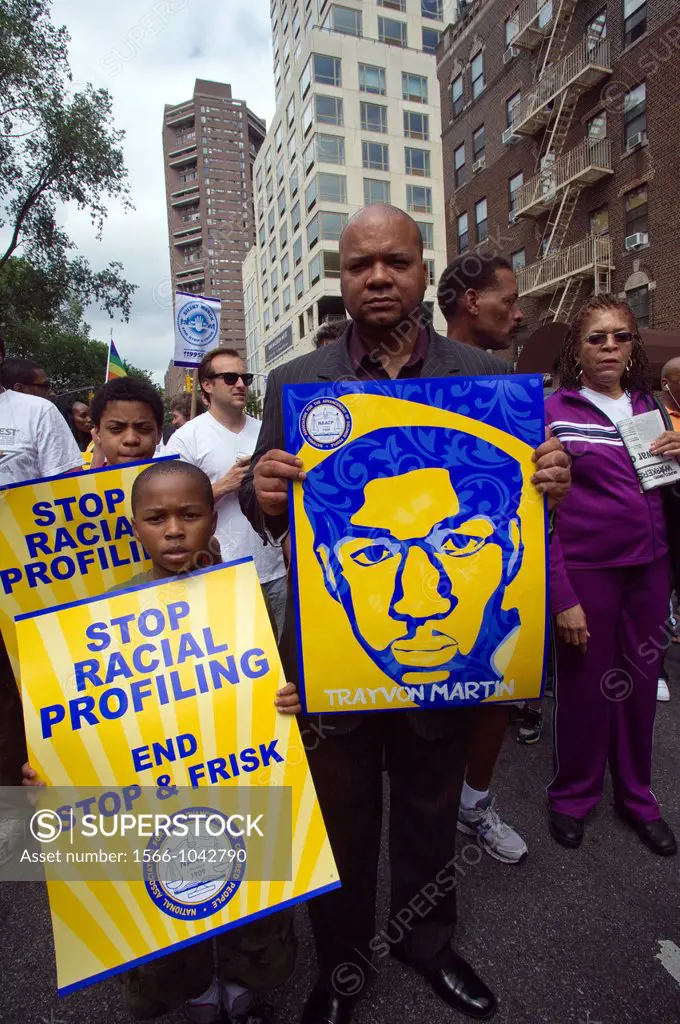 Thousands of demonstrators march down Fifth Avenue in New York for a silent march protesting the NYPD policy of stop and frisk The participants say th...