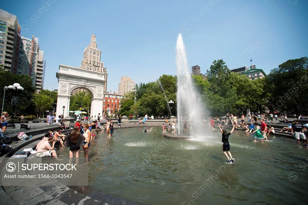New Yorkers and visitors gravitate towards parks with fountains like the fountain in Washington Square Park, in an effort to cool off