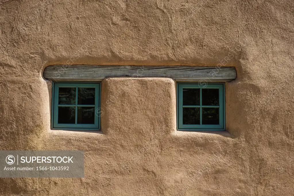 Pair of small square windows on adobe house, Santa Fe, New Mexico, USA