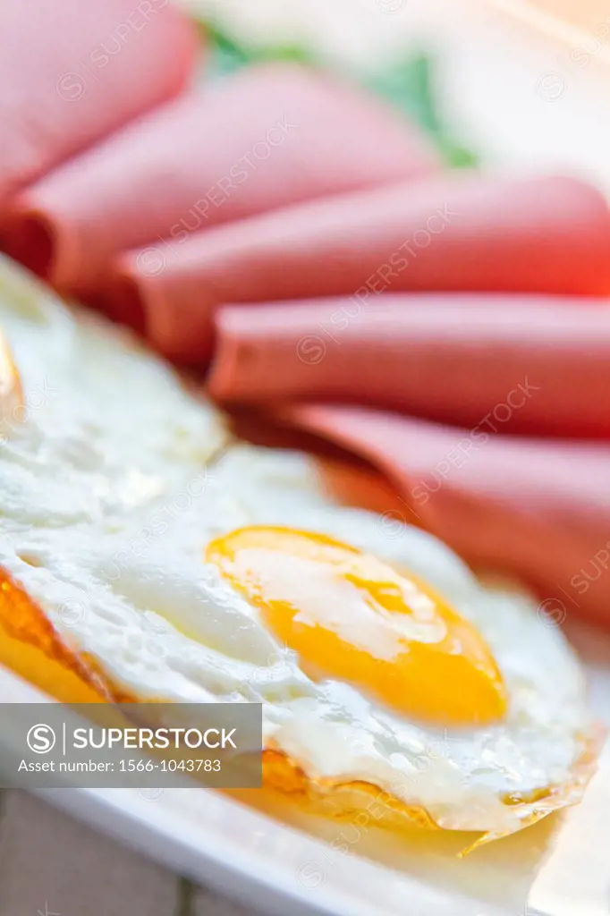 Breakfast plate with Mortadella, eggs 