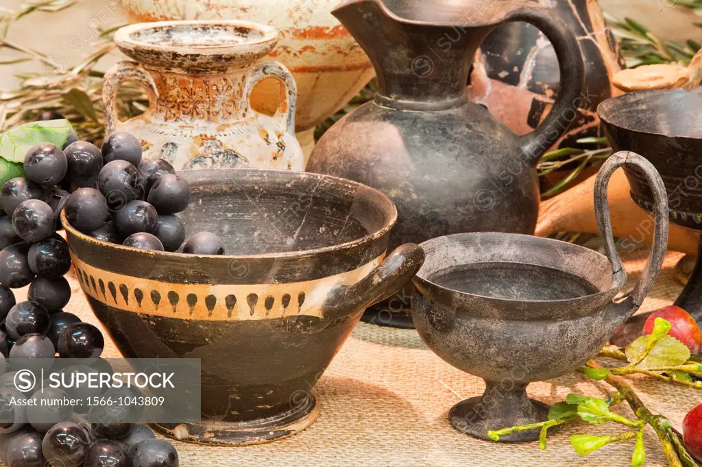 europe, italy, tuscany, vetulonia, archaeological museum, exibition, etruscan food, table laden with pots and utensils for banquet