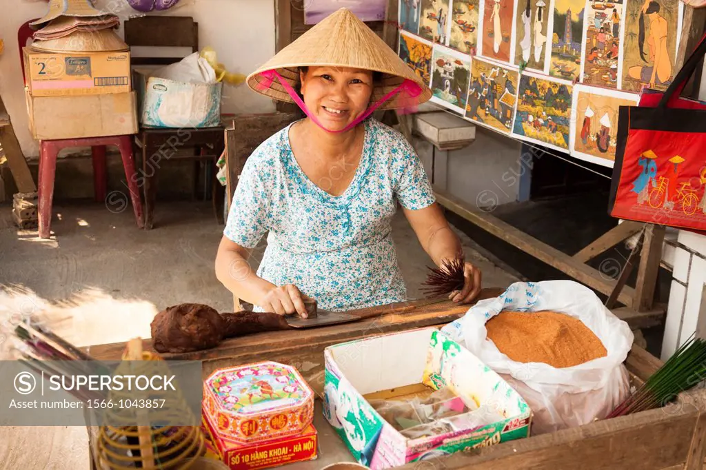 Woman making incense sticks, Thuy Xuan Hat village, near Hue, Vietnam