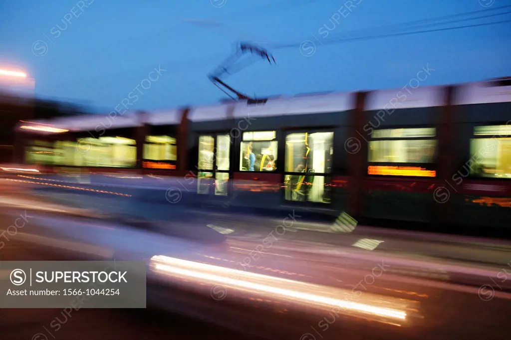 fast metro tram carriage on tracks in city at night rome italy