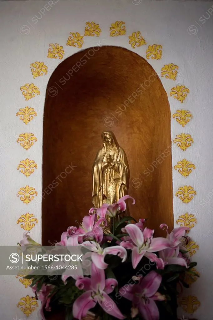 A golden sculpture of the Our Lady of Guadalupe is displayed in Casa de los Frailes hotel in Oaxaca