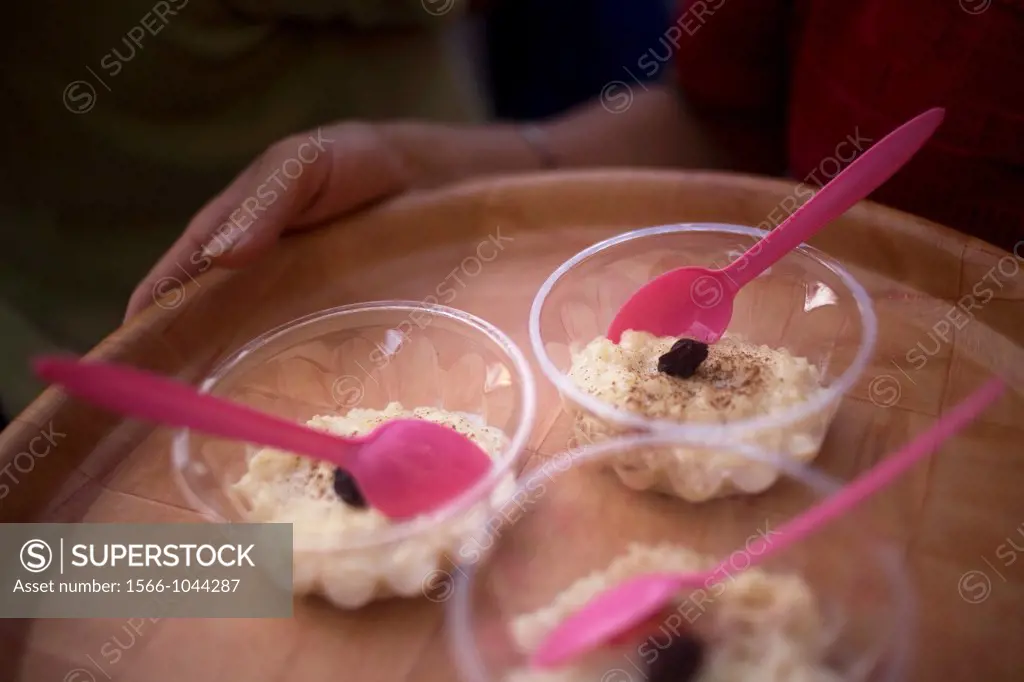 A woman shares food during the Convite of the Carmen Alto neighborhood, in Oaxaca, Mexico, July 12, 2012, in this tradition of the Catholic Virgin of ...